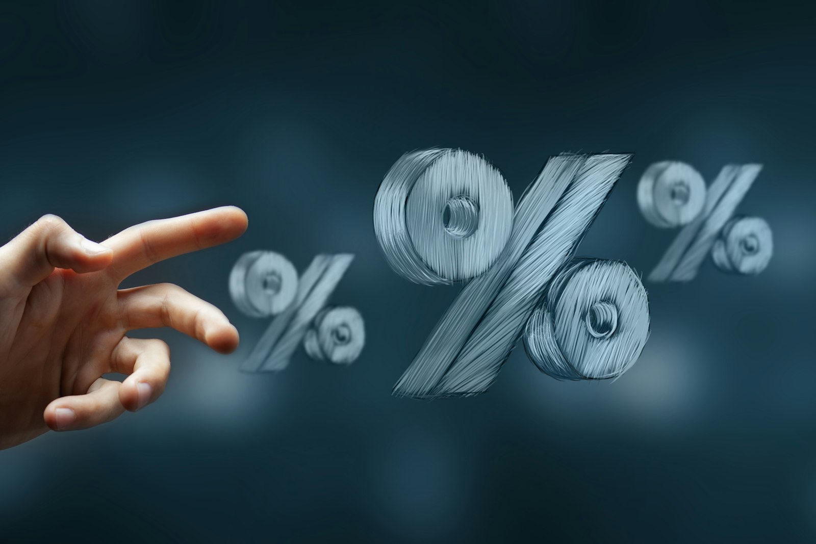 A hand reaching toward floating percentage symbols