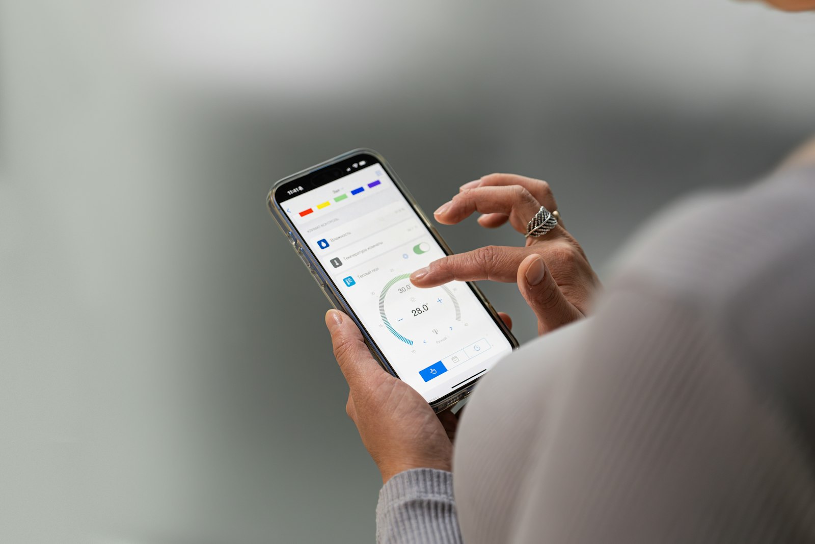 Hands holding a smartphone with a banking app open